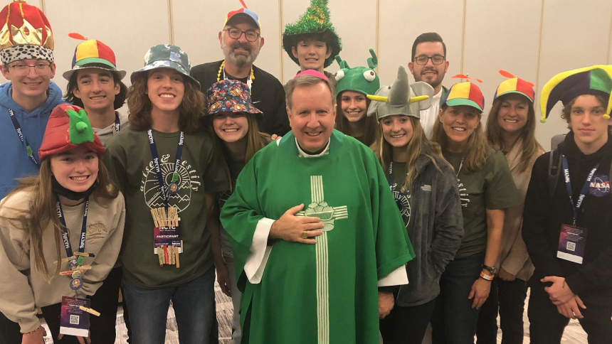 Bishop Robert J. McClory enjoys time with teens during the National Catholic Youth Conference in 2021.