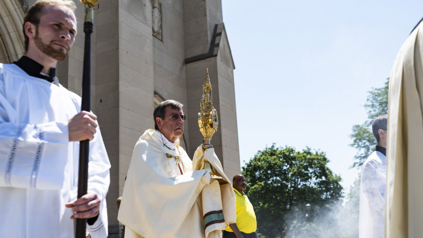 Detroit Archbishop Allen H. Vigneron participates in a Eucharistic procession in 2021.