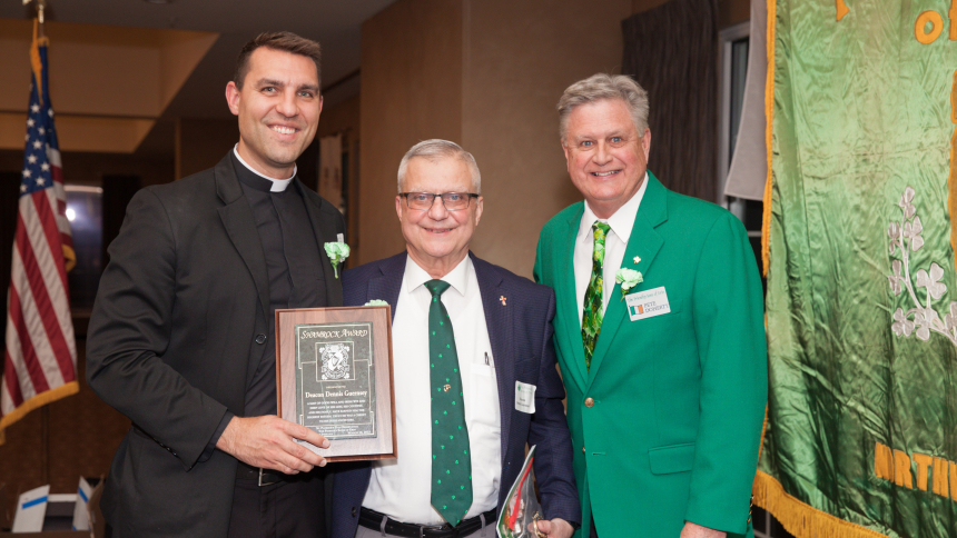 eacon Dennis Guernsey (center) of Portage, receives the 2023 Friendly Sons of Erin Shamrock Award at the annual St. Patrick's Day Dinner 