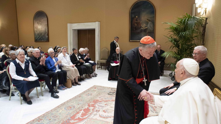 Pope Francis shakes hands with U.S. Cardinal Blase J. Cupich of Chicago, who led a delegation from Catholic Extension during an audience at the Vatican April 26, 2023. Cardinal Cupich is chancellor of the organization's board of governors. The pope thanked the organization for its work "providing assistance to missionary dioceses, particularly in the United States, and in caring for the needs of the poor and most vulnerable." (CNS photo/Vatican Media)