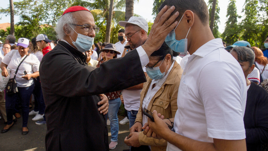 Nicaraguan Cardinal Leopoldo Brenes Solórzano of Managua blesses a devotee during a Good Friday procession outside the Metropolitan Cathedral 
