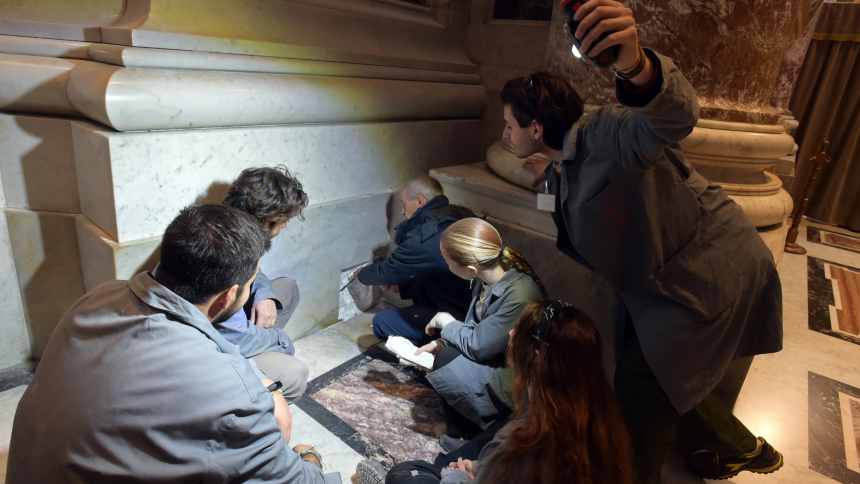 Students at the newly established School of Fine Arts and Traditional Trades of the Fabbrica di San Pietro watch one of the artisans at St. Peter's Basilica work on a wall at the Vatican March 30, 2023. The six-month program is dedicated to encouraging young people to practice traditional crafts and skills that risk dying out. (CNS photo)