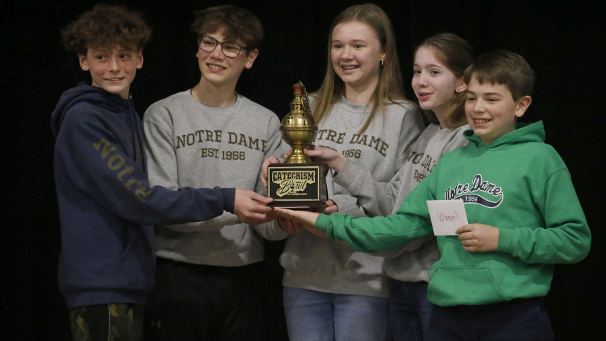Members of the Notre Dame catechism team hold the Catechism Bowl Thurible Trophy after winning the 2023 Catechism Bowl. 