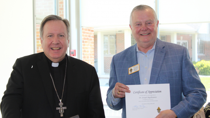 Bishop Robert J. McClory congratulates Dr. Joseph Majchrowicz and presents him with a Certificate of Appreciation reflecting Dr. Majchrowicz' retirement after seven years as superintendent of schools for the Diocese of Gary. "I want to thank him, especially for his leadership during the COVID-19 pandemic when he very quickly showed himself (to be) a loyal, steady hand,” said the bishop at the diocese’s annual Teacher Retirement and Recognition Banquet on May 3 at Innsbrook Country Club in Merrillville. (Mar
