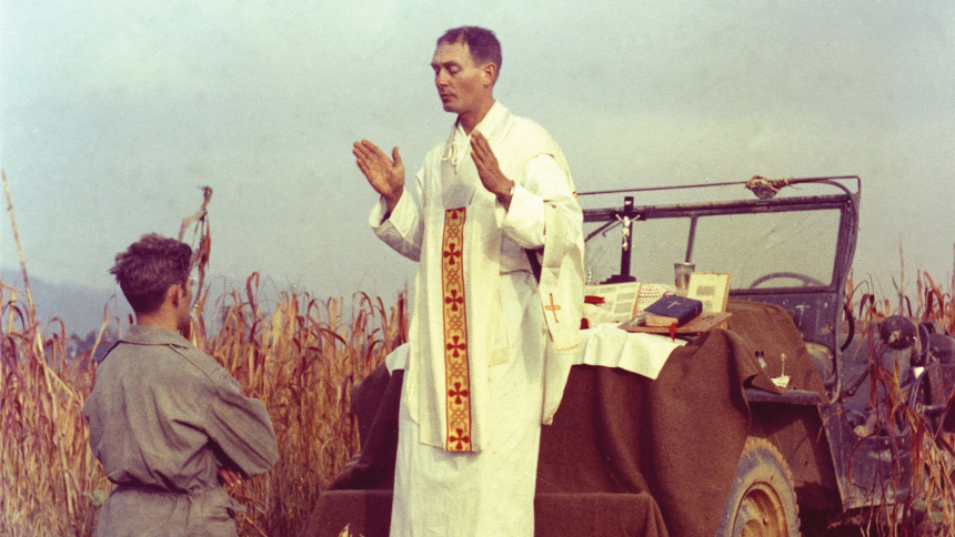 Father Emil Joseph Kapaun, a U.S. Army chaplain, is pictured celebrating Mass from the hood of a jeep Oct. 7, 1950, in South Korea. A candidate for sainthood, he died May 23, 1951, in a North Korean prisoner of war camp. A new 15-minute film from the Knights of Columbus titled "The Magazine and the Miracle: Finding Father Kapaun" traces the journey of Father Kapaun's mortal remains from a shallow grave in the prisoner-of-war camp where he died to their eventual return to his home Diocese of of Wichita, Kan.