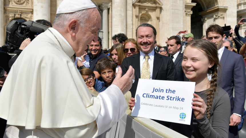 Pope Francis greets Swedish climate activist Greta Thunberg during his general audience in St. Peter's Square at the Vatican in this file photo from April 17, 2019. In a new book, Pope Francis writes that people must learn from young people to care for the poor and for the environment. (CNS photo/Vatican Media)