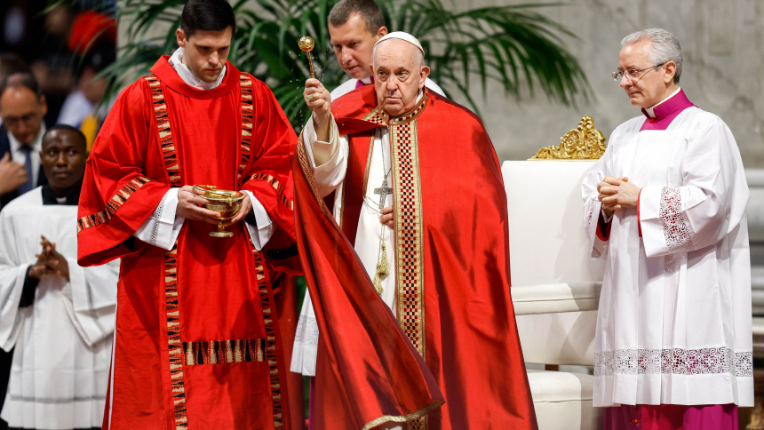 Pope Francis sprinkles holy water at the beginning of his Pentecost Mass in St. Peter's Basilica at the Vatican May 28, 2023. (CNS photo/Lola Gomez)