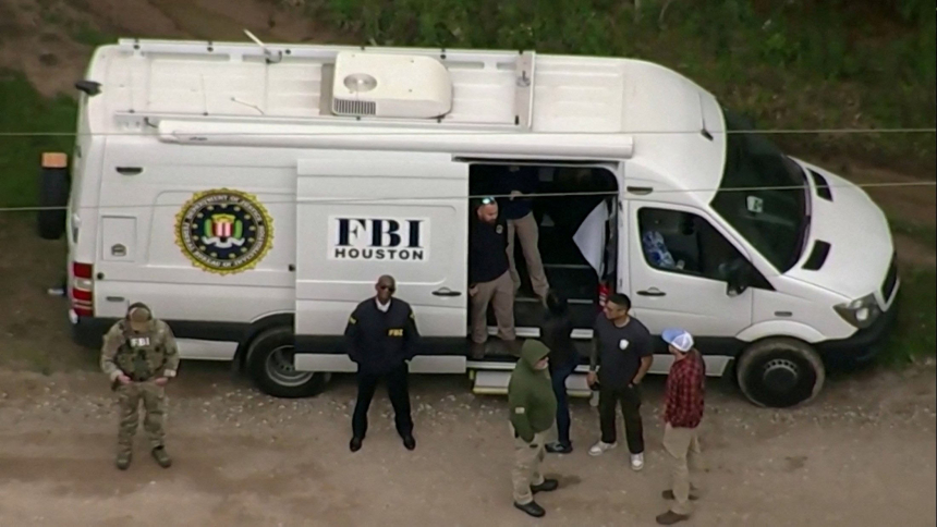 An aerial view shows a Federal Bureau of Investigation (FBI) van where a search is being conducted for Francisco Oropesa, 38, who police say shot dead five neighbors in Cleveland, Texas, 