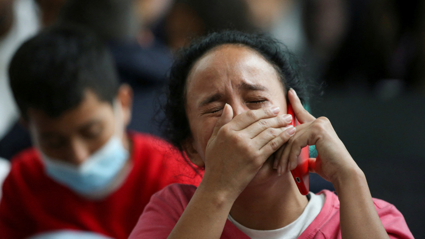 A Colombian migrant woman reacts at the El Dorado International Airport in Bogota, Colombia, May 11, 2023, after being deported from the United States, as the U.S. prepares to lift the COVID-19 era restrictions known as Title 42, that have blocked migrants at the U.S.-Mexico border from seeking asylum since 2020. (OSV News photo/Luisa Gonzalez)