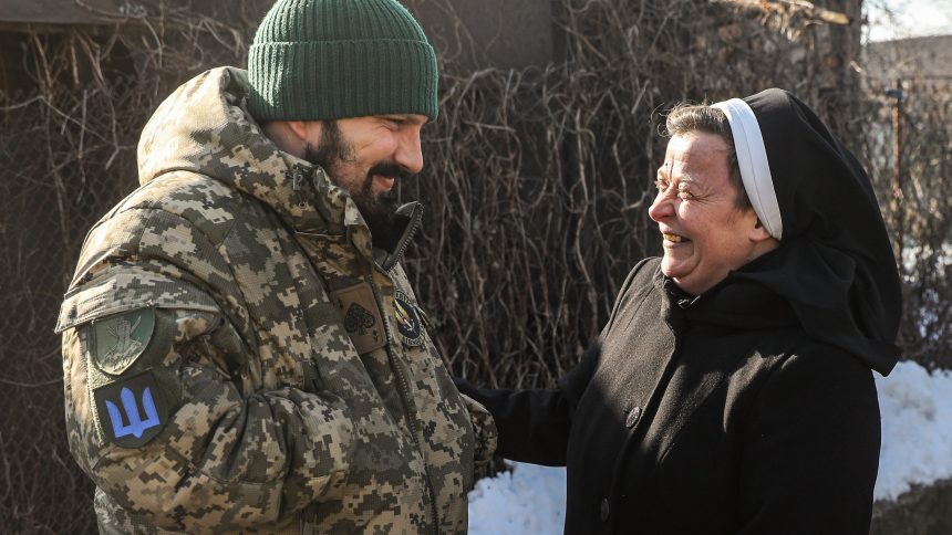 Basilian Sister Lucia Murashko, right, speaks with volunteer Denys Kuprikov at the Basilian monastery in Zaporizhzhia, Ukraine, Feb. 7, 2023. Together, with Ivan Smyglia, they have distributed humanitarian aid along the front line of Russia's war in Ukraine about 30 miles away. (OSV News photo/Konstantin Chernichkin, CNEWA)