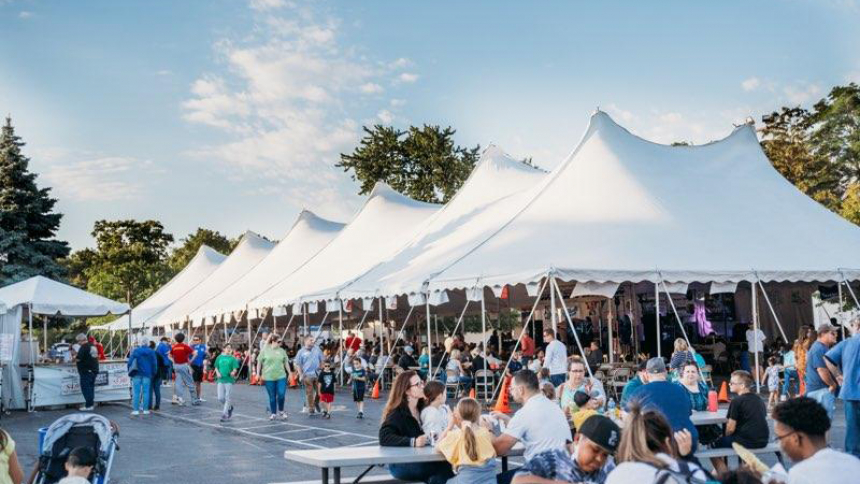 Festival goers at the 2022 St. Thomas More, Munster, parish festival enjoy activities under the tents and around the church campus. The festival provides a relaxed atmosphere for families to enjoy food, music and neighborly competition. (Provided photo)