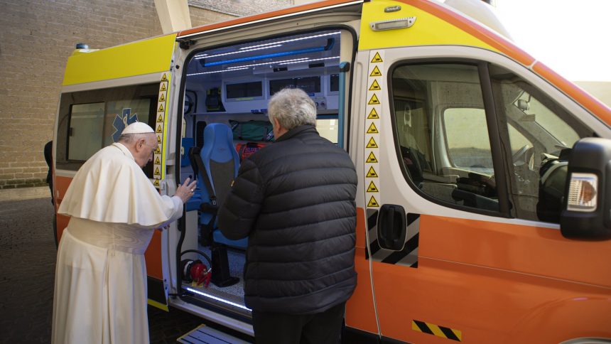 Pope Francis blesses an ambulance to donate to the Ukrainian city of Lviv, in this file photo taken at the Vatican March 26, 2022. Also pictured is Cardinal Konrad Krajewski, the papal almoner, who drove the ambulance to Lviv. (CNS photo/Vatican Media)