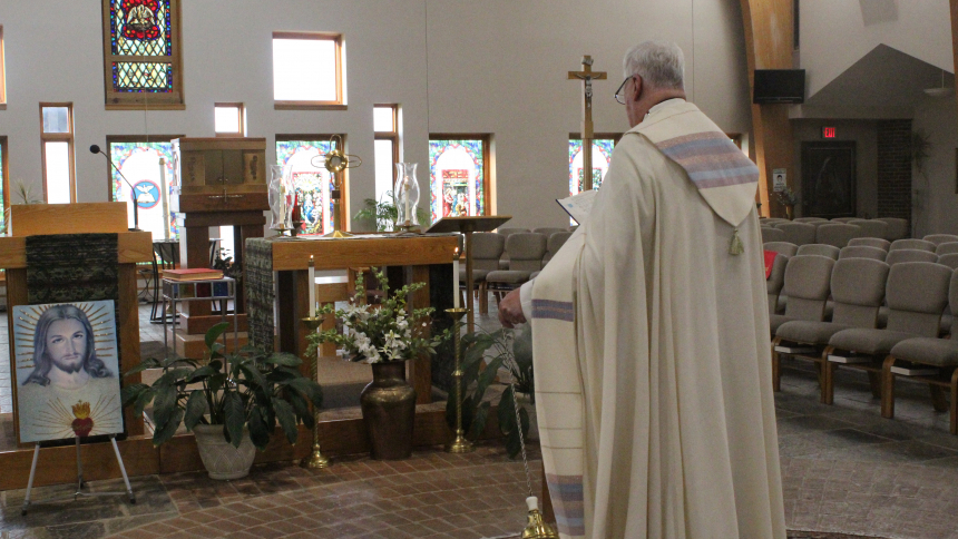 Father Thomas Mischler, pastor, blesses the Holy Eucharist (in the monstance on the altar) during a Holy Hour hosted by Knights of Columbus Council 7473 at Holy Spirit in Winfield on June 16, the Solemnity of the Sacred Heart. A special prayer service included the Litany of the Sacred Heart offered "as an act of reparation for the blasphemies against our Lord (that) we see in our culture today," according to a statement from the U. S. Conference of Catholic Bishops. (Marlene A. Zloza photo)