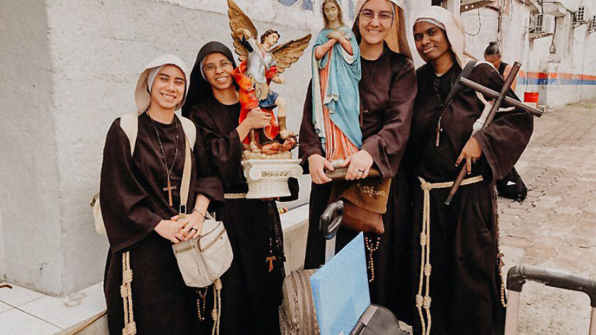 Members of the Sisters Poor of Jesus Christ pose with statues of St. Michael the Archangel and Mary and a crucifix after arriving in El Salvador after leaving Nicaragua July 3, 2023. The community announced that day they left their post in Nicaragua, becoming the latest community of women religious to leave the country where the regime of President Daniel Ortega has cracked down on the Catholic Church. (OSV News photo/courtesy Sisters Poor of Jesus Christ via Facebook)      