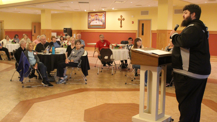 A sizable crowd of 40+ Catholics took an in-depth look at the Beatitudes thanks to a Theology Uncorked program presented by Father Greg Bim-Merle at St. Michael the Archangel in Schererville on June 27. He explained each of the eight statements taught by Jesus in the Sermon on the Mount, saying "We should want to follow them, because there is a reward connected to each one," Father Bim-Merle, administrator of St. James the Less in Highland. (Marlene A. Zloza photo)