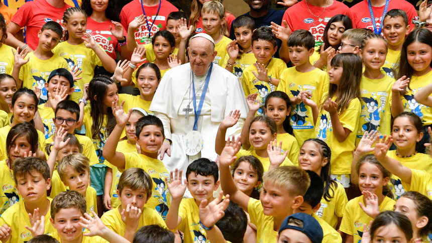 Pope Francis poses for a photo with children in the Vatican's Paul VI audience hall July 18, 2023. About 250 children of Vatican employees are attending a summer program July 3-Aug. 4. (CNS photo/Vatican Media)