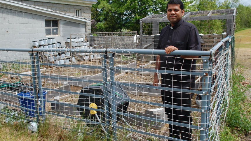 Father Benny Chittilappilly stands in his garden plot in Newport, Vt., May 25, 2023, before planting. For Father Chittilappilly, a Vocationist priest from southern India, gardening is about more than growing vegetables. (OSV News photo/Cori Fugere Urban, Vermont Catholic)