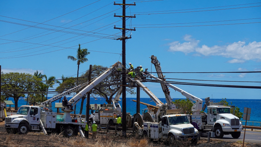 Workers repair utility lines in the fire ravaged town of Lahaina on the Hawaiian island of Maui Aug. 15, 2023. (OSV News photo/Mike Blake, Reuters)