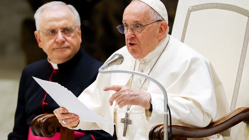 Pope Francis talks to visitors about Our Lady of Guadalupe and the importance of inculturating the faith during his weekly general audience in the Paul VI Audience Hall at the Vatican Aug. 23, 2023. Msgr. Leonardo Sapienza, an official of the Prefecture of the Papal Household, looks on. (CNS photo/Lola Gomez)