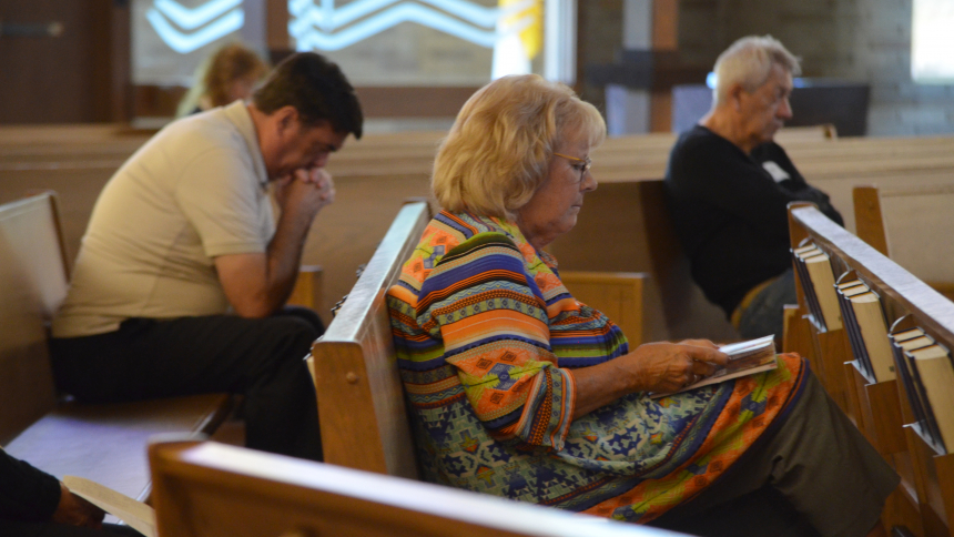 Shelia Brune, of St. Matthias in Crown Point, spends time in prayer as part of the Diocesan Pastoral Council meeting on Sept. 9 at Queen of All Saints in Michigan City. Members were asked to discern what is the most important issue currently facing the local Church. (Erin Ciszczon photo)