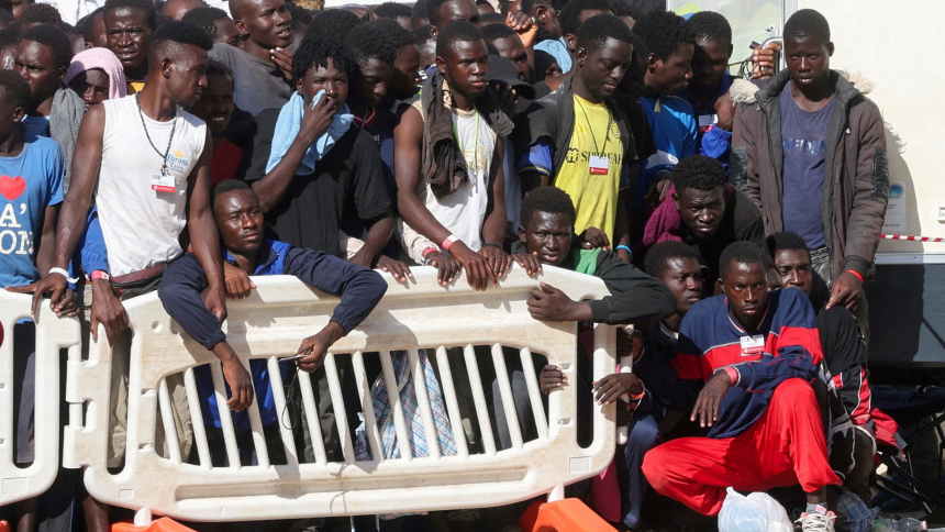 Migrants are pictured Sept. 17, 2023, at the port on the Italian island of Lampedusa while waiting to be transferred to the mainland. (OSV New photo/Yara Nardi, Reuters)