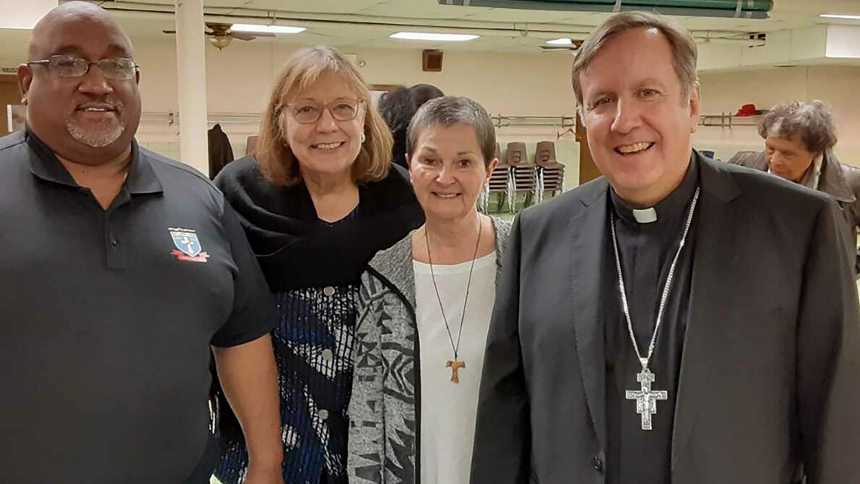 Meeting Bishop Robert J. McClory (right) in 2020 at a reception hosted by Ss. Monica and Luke in Gary were (from left) Deacon Martin Brown and Holy Name of Jesus parishioners Anita Torok and Carol Hoffman from Cedar Lake. Hoffman serves with several ministries, all centering on the Eucharist. (Provided photo)