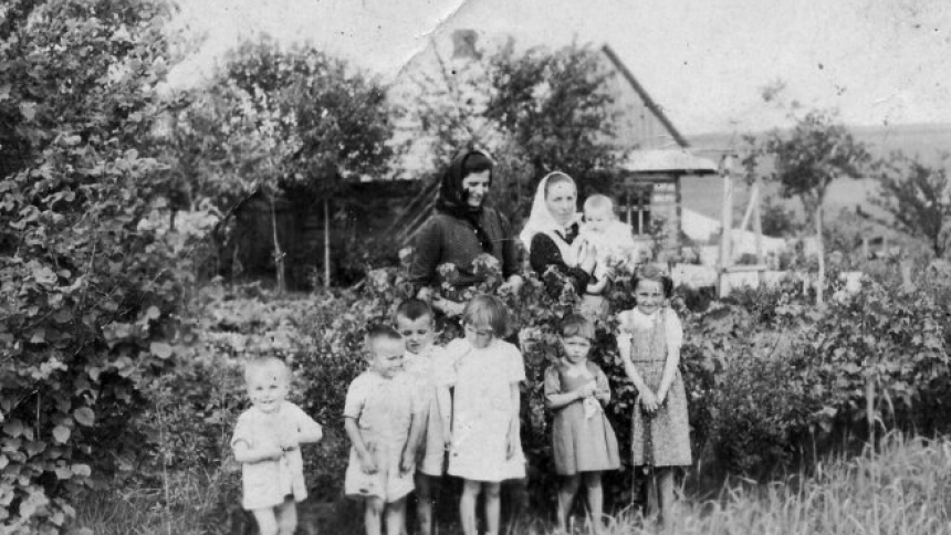 Wiktoria Ulma (holding a child) stands with her six children in front of their house in Markowa, Poland, in this undated photo. (The identity of the woman standing next to Wiktoria is not known.) The Ulma family and Jews they were sheltering were murdered by the Germans March 24, 1944, when the Nazi occupiers were informed that Jews are sheltered in their home. Wiktoria and her husband, Józef, their seven children (including the couple's unborn baby) will be beatified Sept. 10, 2023, in Markowa. (OSV News p