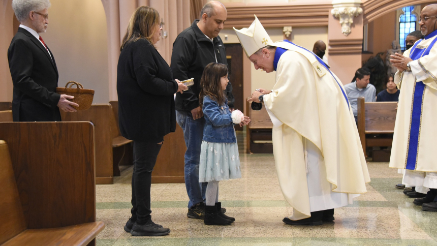 Bishop Greets Child