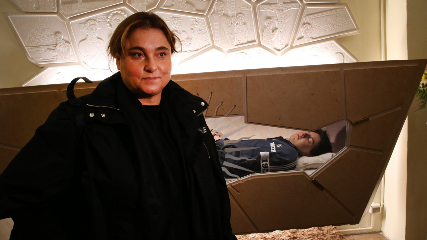 Antonia Salzano Acutis, mother of Blessed Carlo Acutis, stands in front of her late son's body, entombed in the Church of Santa Maria Maggiore in Assisi, Italy, Oct. 1, 2020. Antonia Acutis spoke at gatherings in New York, New Jersey, Pennsylvania, Washington and Texas during a Sept. 28-Oct. 4, 2023, tour. (CNS photo/courtesy Diocese of Assisi-Nocera Umbra-Gualdo Tadino)