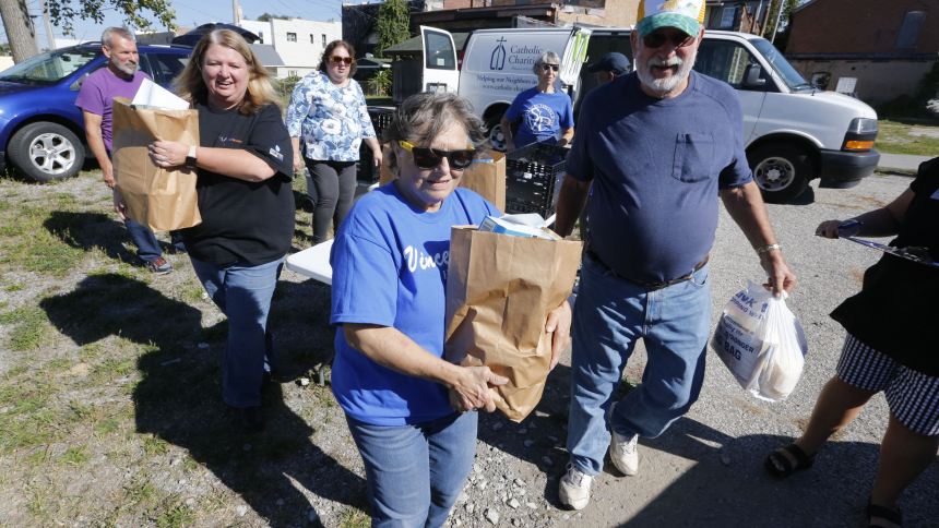 Volunteers from Ss. Cyril and Methodius assist with the Catholic Charities Mobile Food Pantry distibution in North Judson on Oct. 3. (Bob Wellinski photo)