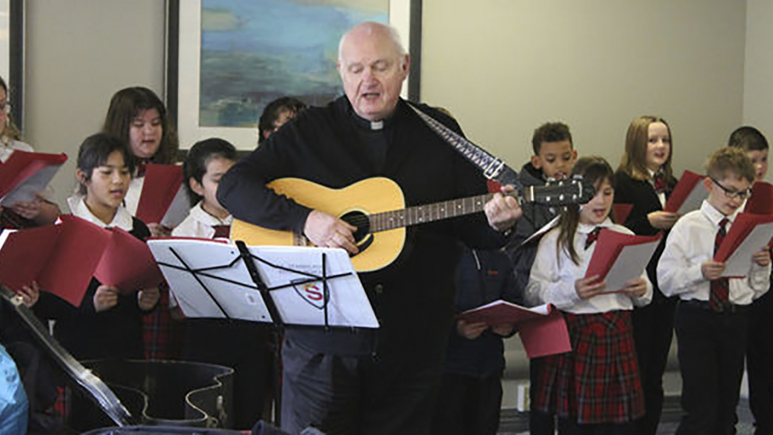 Father Walter Ciesla has shared his musical talent through the years, including leading St. Stanislaus Kostka School students on a Christmas carolling visit to a Michigan City McDonald's restaurant. Folk music is his favorite genre, and he once performed for a bishops retreat, prompting then-Bishop Andrew G. Grutka of the Diocese of Gary to exclaim, "That's my boy!" (Provided photo)