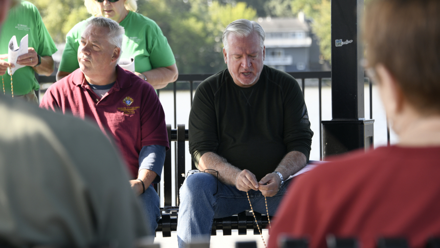 Family Rosary for Life founder Mark Gabrione (center) leads in prayer during a rally on Sept. 9 at the gazebo on Lake George in Hobart. Through public Rosary recitation, devotional invocations and singing spiritual songs, the prayer group founded three years ago has prioritized seeking God's assistance as they advocate for the end to abortion and the protection of religious liberty. (Anthony D. Alonzo photo)