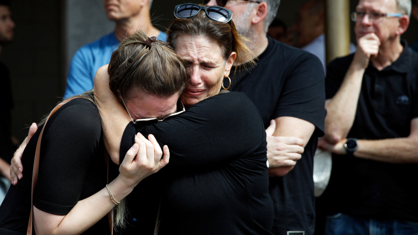 Family and friends mourn Danielle, 25, and Noam, 26, an Israeli couple who were killed in a deadly attack by Hamas gunmen from Gaza as they attended a festival, as they are buried next to each other during their funeral in Kiryat Tivon, Israel, Oct. 12, 2023. The Israel-Hamas war so far has claimed more than 2,600 lives. (OSV News photo/Shir Torem, Reuters)