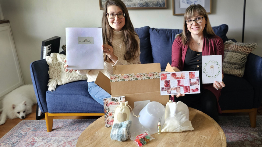 Held in Hope founders Kenzie Covarrubias and Amber Hassett display items found in one of the kits. The two LaPorte County residents created the kits to aid mothers who are experiencing a first trimester miscarriage. (Bob Wellinski photo)