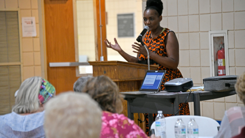 Pam Matambanadzo, national vice president of Friendship and Community for the Society of St. Vincent de Paul, delivers remarks about making charity personal at the diocesan SVDP conference Voice of the Poor seminar on Oct. 21 in the gymnasium at St. Bridget school in Hobart. Presentations, including interactive role-playing of charitable delivery scenarios, were part of the event’s theme of ‘Going Beyond Charity As We See the Face of Jesus in Our Neighbors.’ (Anthony D. Alonzo photo) 