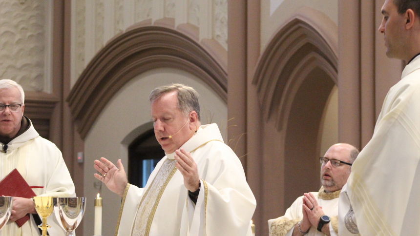 Bishop Robert J. McClory (center) celebrates a Mass of Remembrance for deceased bishops, priests and deacons from the Diocese of Gary on Nov. 7 at the Cathedral of the Holy Angels in Gary. Concelebrating were Father Michael Surufka, O.F.M. (left), rector at the cathedral and pastor of Ss. Monica and Luke, St. Joseph the Worker and St. Mary of the Lake parishes in Gary, and Father Chris Stanish (right), vicar general and moderator of the curia. (Marlene A. Zloza photo)
