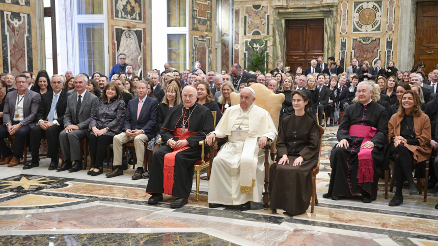 Pope Francis poses for a photo with members of the Patrons of the Arts in the Vatican Museums during an audience in the Apostolic Palace Nov. 9, 2023. He is seated between Cardinal Fernando Vérgez Alzaga, president of the commission governing Vatican City State, and Sister Raffaella Petrini, secretary-general of the commission and a member of the Franciscan Sisters of the Eucharist. (CNS photo/Vatican Media)