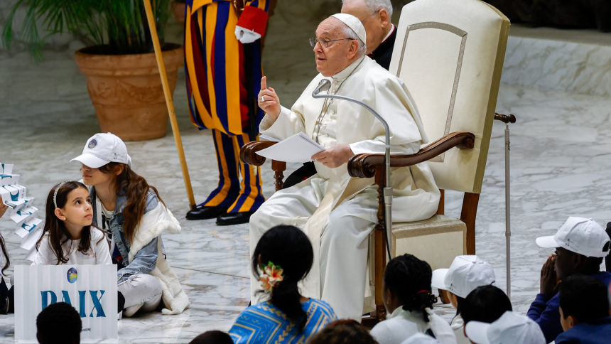 Pope Francis gestures as he speaks to children from different parts of the world at an event called "Let Us Learn from Boys and Girls" in the Paul VI hall at the Vatican Nov. 6, 2023. (CNS photo/Lola Gomez)