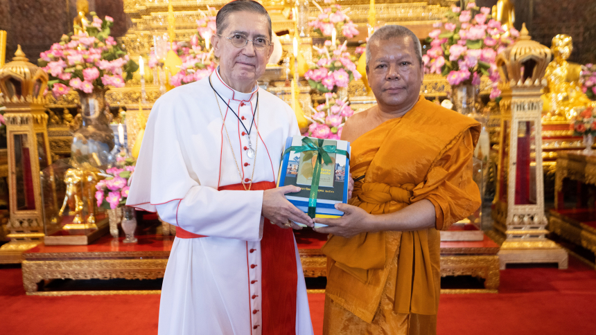 Cardinal Miguel Ángel Ayuso Guixot, prefect of the Dicastery for Interreligious Dialogue, poses for a photograph with a Buddhist dignitary at the Temple of the Reclining Buddha in Bangkok, Thailand, Nov. 16, 2023. The dicastery helped organize the seventh Buddhist-Christian Colloquium in Bangkok Nov. 13-16 to discuss the importance of dialogue for healing humanity and the earth. (CNS photo/courtesy of Dicastery for Interreligious Dialogue)