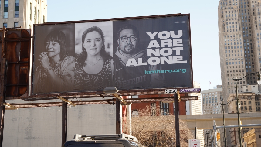 A billboard towering over Fort Street near Cass Avenue in downtown Detroit, pictured Dec. 13, 2023, encourages drivers and passersby to discover Jesus' presence in the holy Eucharist. Part of the Detroit Archdiocese's I AM HERE campaign, the billboard invited viewers to visit the website iamhere.org to discover its message -- about Jesus -- and find testimonials of individuals whose lives have been changed by Eucharistic adoration. The billboard was on display from Nov. 14 to mid-December, but the I AM HERE