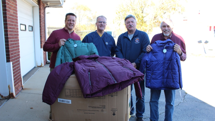 At Catholic Charities in Gary, Executive Director Terry Seljan (from left) welcomes a donation of winter outerwear for 50 children from St. Matthias Knights of Columbus Council 16945 members Scott May, Mike Havens and Sam Brune of Crown Point on Nov. 15. Council 16945 has participated in the Knights' nationwide Coats for Kids project since it was established five years ago. (Provided photo)