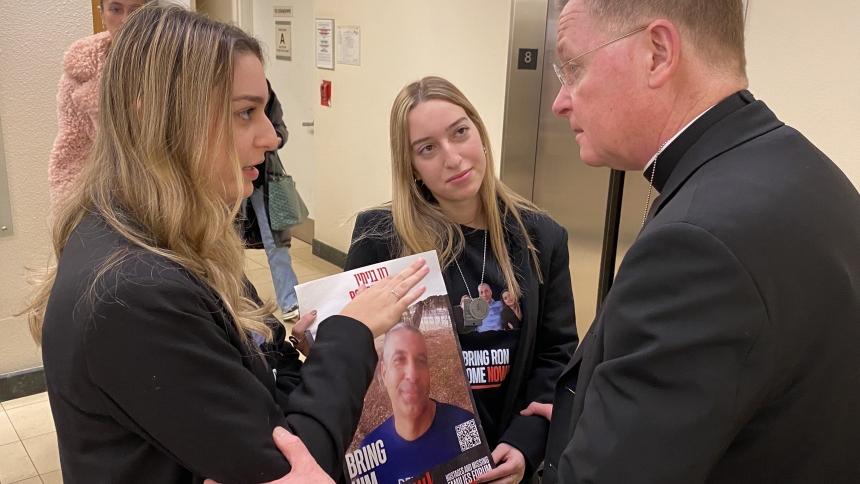 New York Auxiliary Bishop Edmund J. Whalen, right, consoles the daughters of Hamas hostage Ron Benjamin Dec. 13, 2023. Benjamin, 53, was kidnapped by Hamas fighters Oct. 7 while riding his bicycle not far from Israel's border with the Gaza Strip. (OSV News photo/Steven Schwankert, The Good Newsroom)