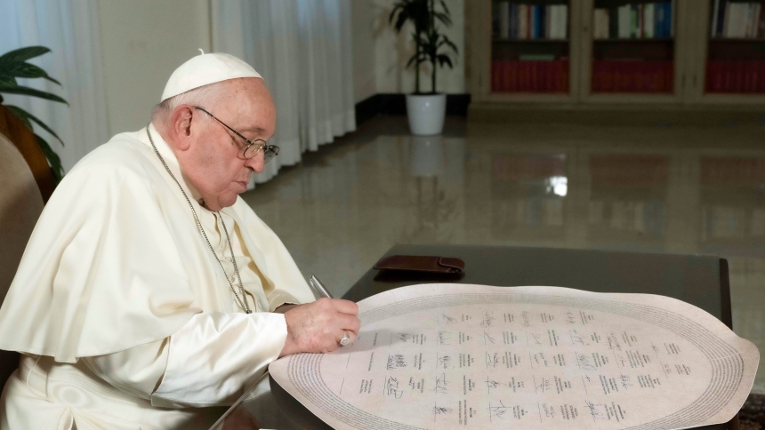 Pope Francis signs the Interfaith Statement on Climate Change in his Vatican residence Dec. 3, 2023. The pope had been scheduled to sign the document at the Faith Pavilion at COP28 in Dubai, United Arab Emirates, but was forced to cancel the trip because of a bronchial infection. (CNS photo/Vatican Media)