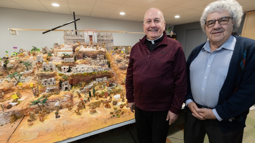 An Oct. 19, 2023, photo shows Father Allen Kuss, pastor of St. Patrick Patrick in Edina, Minn., and Don Keller, a retired medical illustrator, standing in front of the diorama they created of Bethlehem that includes a Nativity scene. Their approach was to show a busy and bustling city of Bethlehem that would have been filled with many people at the time of Christ's birth. The diorama opened for public display in St. Patrick Church Dec. 8, the feast of the Immaculate Conception, and will be on view through F