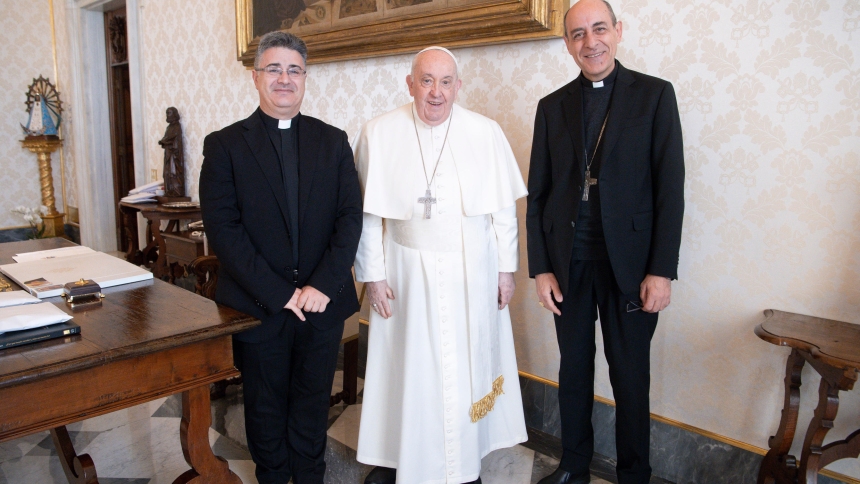 Pope Francis poses for a photo with Msgr. Armando Matteo, left, secretary of the doctrinal section of the Dicastery for the Doctrine of the Faith, and Cardinal Víctor Manuel Fernández, dicastery prefect, during a meeting in the library of the Apostolic Palace at the Vatican Dec. 18, 2023. (CNS photo/Vatican Media)