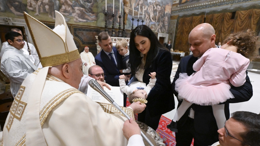 Pope Francis baptizes a baby during Mass in the Sistine Chapel at the Vatican Jan. 7, 2024, the feast of the Baptism of the Lord. (CNS photo/Vatican Media)