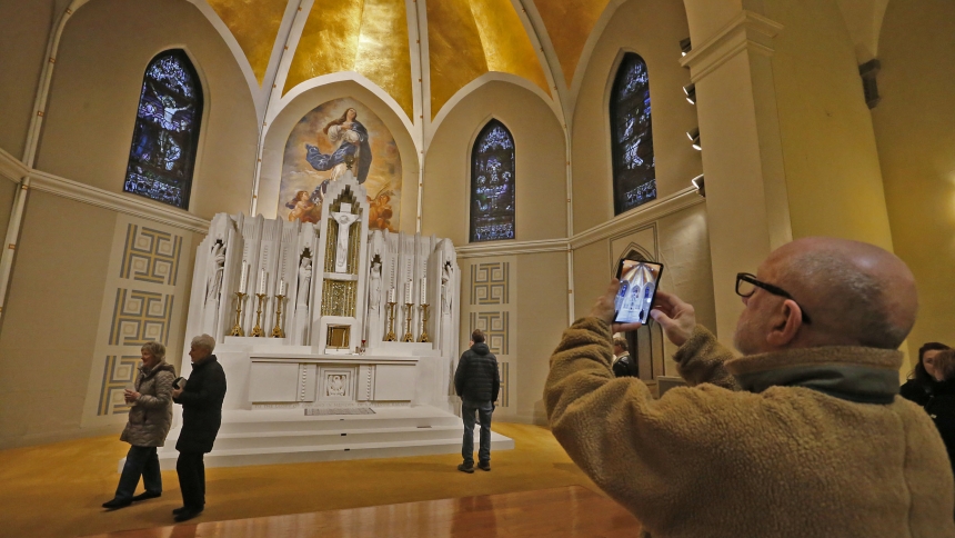 Visitors tour, and photograph, St. Mary the Immaculate Conception during the Michigan City Sacred Architecture Tour on Nov. 26. (Bob Wellinski photo)