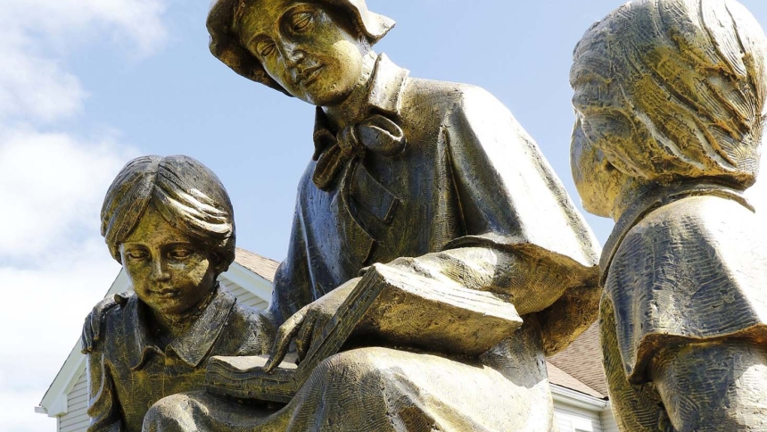 St. Elizabeth Ann Seton, patroness of Catholic schools in the U.S., is depicted instructing schoolchildren in a sculpture seen in front of Sts. Philip and James School in St. James, N.Y. Her Jan. 4 feast day in 2024 kicked off a two-year commemoration of both Mother Seton's milestone birthday and the 50th anniversary of her canonization, which will fall in 2025. (OSV News photo/CNS file, Gregory A. Shemitz)  