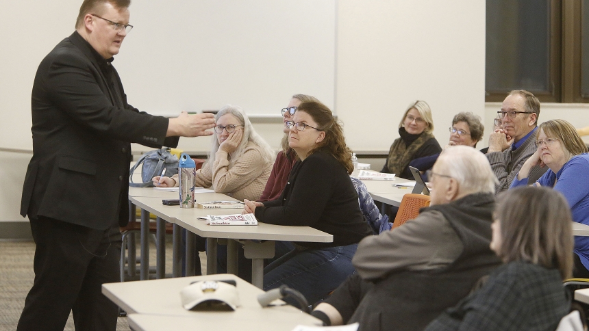 Participants listen to Father David Kime, pastor of Queen of All Saints in Michigan City, lead a discussion during the Feb. 5 class on “Six Great Ideas.” The six-session course is based on the book of the same name by Mortimer J. Adler. (Bob Wellinski photo)