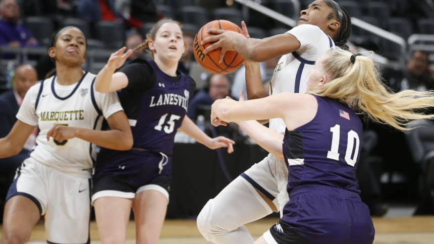 Marquette's Laniah Davis drives to the basket past Lanesville's Ava Kerr as Marquette 's Natalie Robinson and Lanesville's Emma Davis battle for position during the IHSAA Class 1A girl's state basketball championship on Feb. 24 in Indianapolis. (Bob Wellinski photo)